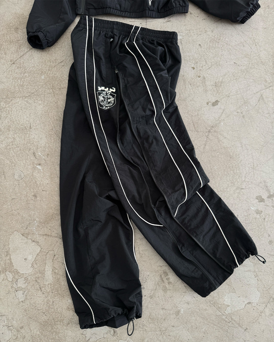TRIKKO X GRIMEY TRACK PANTS